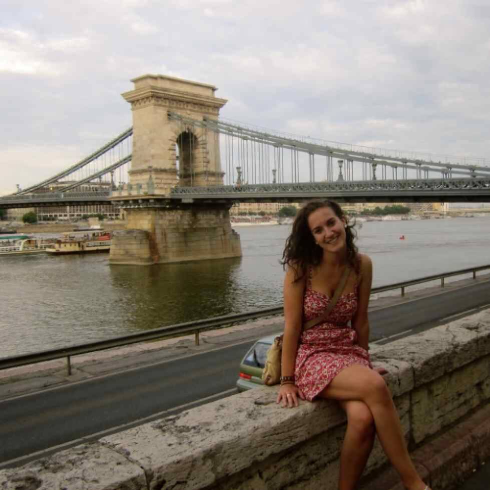 Student sitting on bridge in Czech Republic